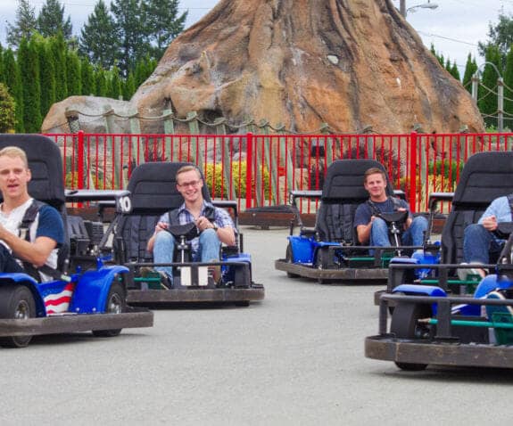 Group of young professionals racing on the Go Kart track
